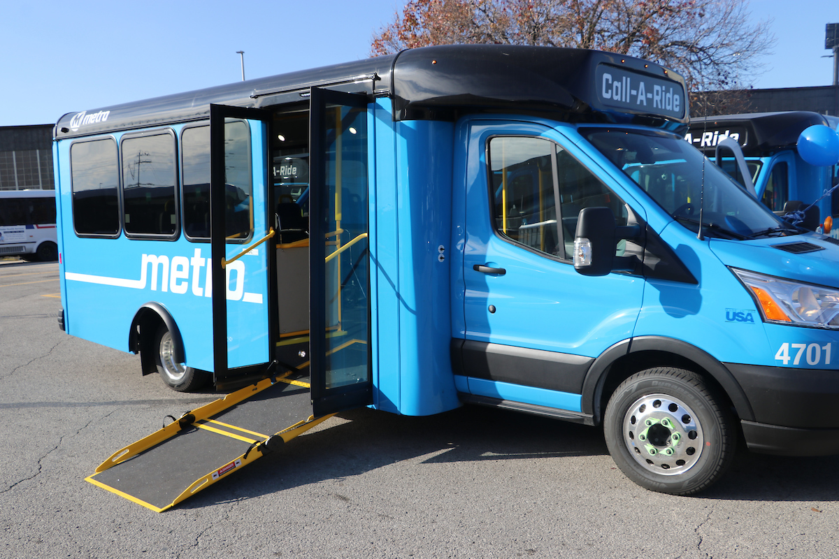 A Call‑A‑Ride van parked with its passenger doors open and ramp extended